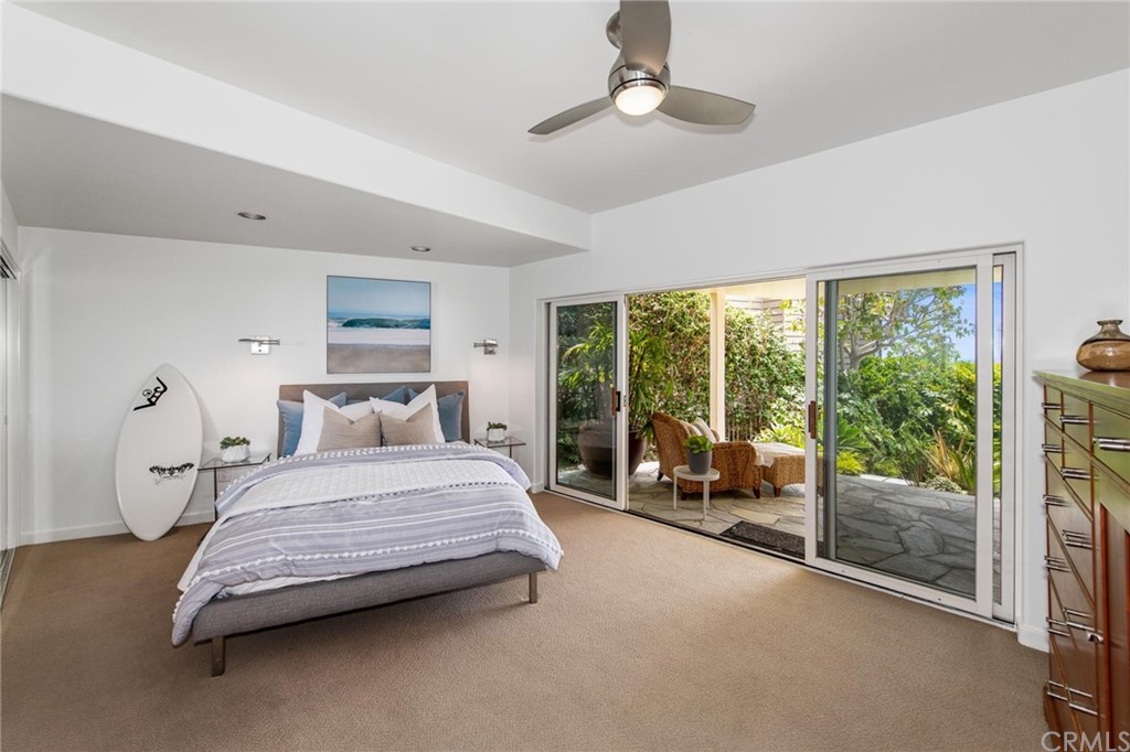 31597 Table Rock Drive Laguna Beach, CA 92651 - Photo 58 of 75 a bedroom with a bed and a large window