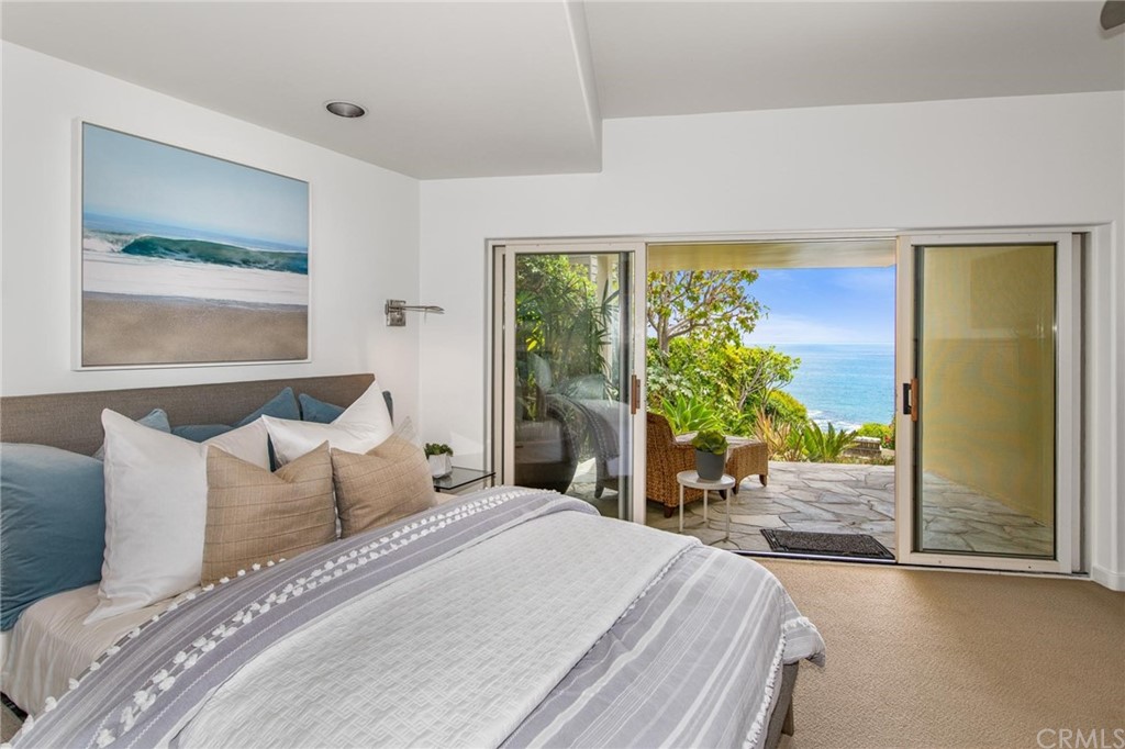 31597 Table Rock Drive Laguna Beach, CA 92651 - Photo 60 of 75 a bedroom with a large bed and a large window