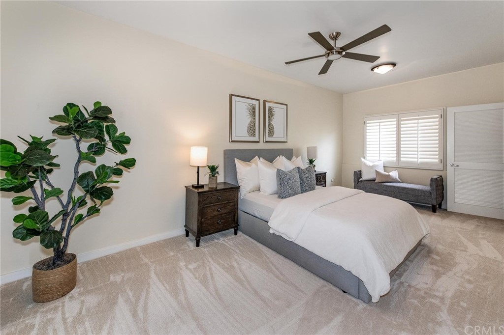 31597 Table Rock Drive Laguna Beach, CA 92651 - Photo 63 of 75 a bedroom with a large bed and a potted plant