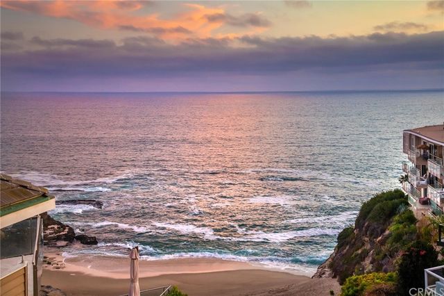 a kitchen with stainless steel appliances a stove a sink and a refrigerator