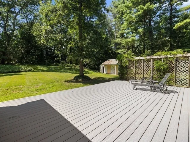 a view of a patio with wooden floor
