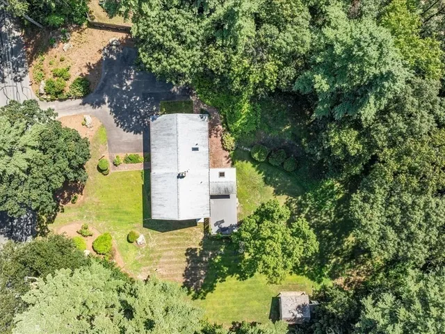an aerial view of residential house with outdoor space