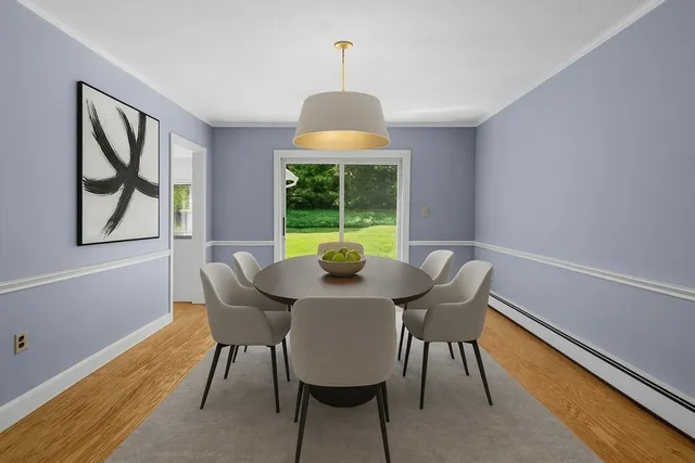 a view of a dining room with furniture window and outside view