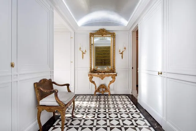 a bathroom with a tub sink and mirror
