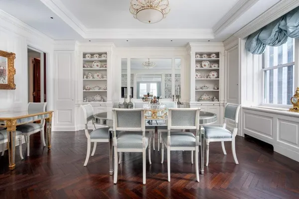 a dining room with furniture window wooden floor