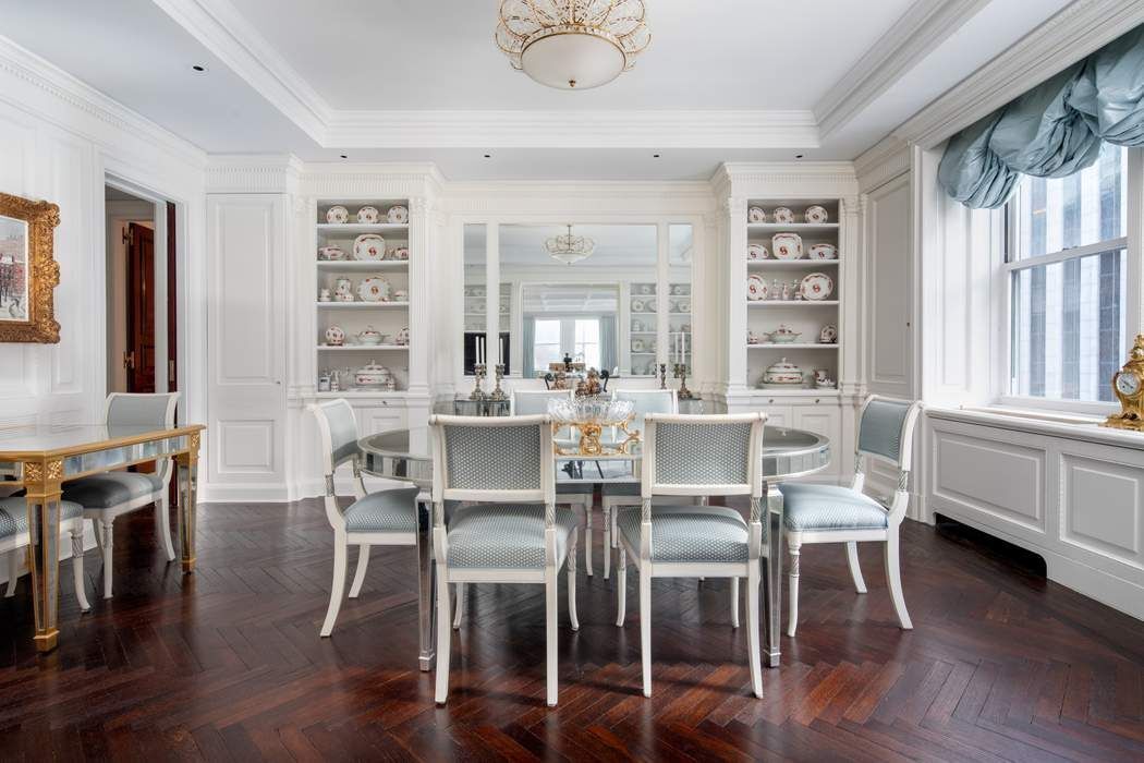 781 5th Avenue, Unit 505 Manhattan, NY 10022 - Photo 2 of 14 a dining room with furniture window wooden floor
