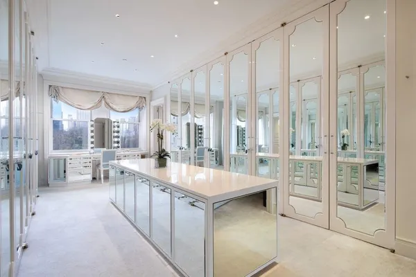 a bathroom with a sink a mirror and shower