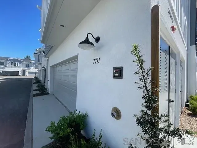 a kitchen with a refrigerator and a sink