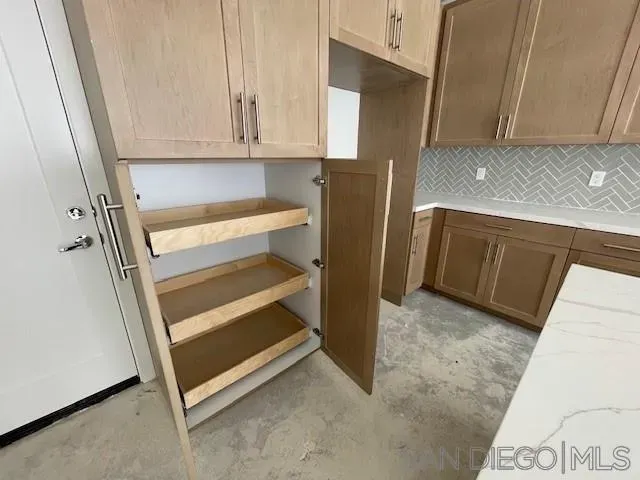 a wooden door with an outdoor space