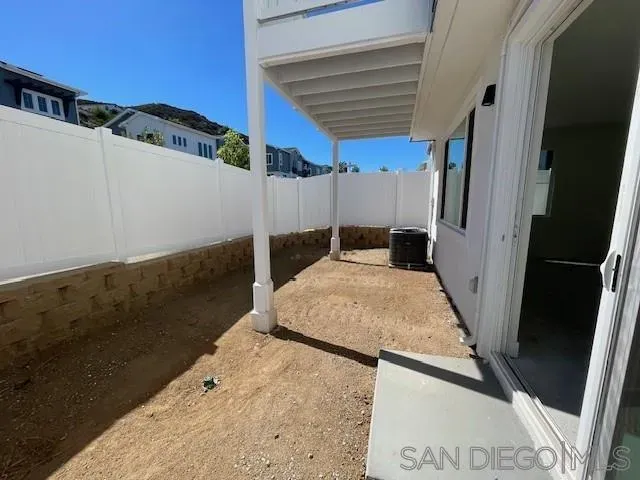 a view of sign board with flower plants
