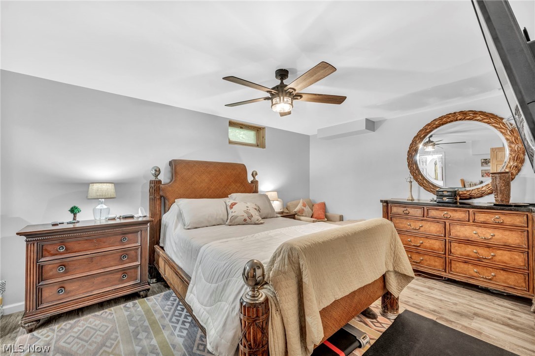 6730 Avon Belden Road North Ridgeville, OH 44039 - Photo 31 of 35 Hardwood floored bedroom featuring ceiling fan