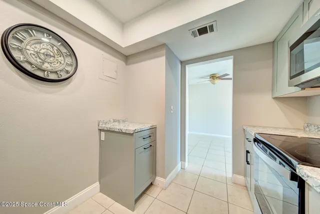 a kitchen with a stove and a refrigerator