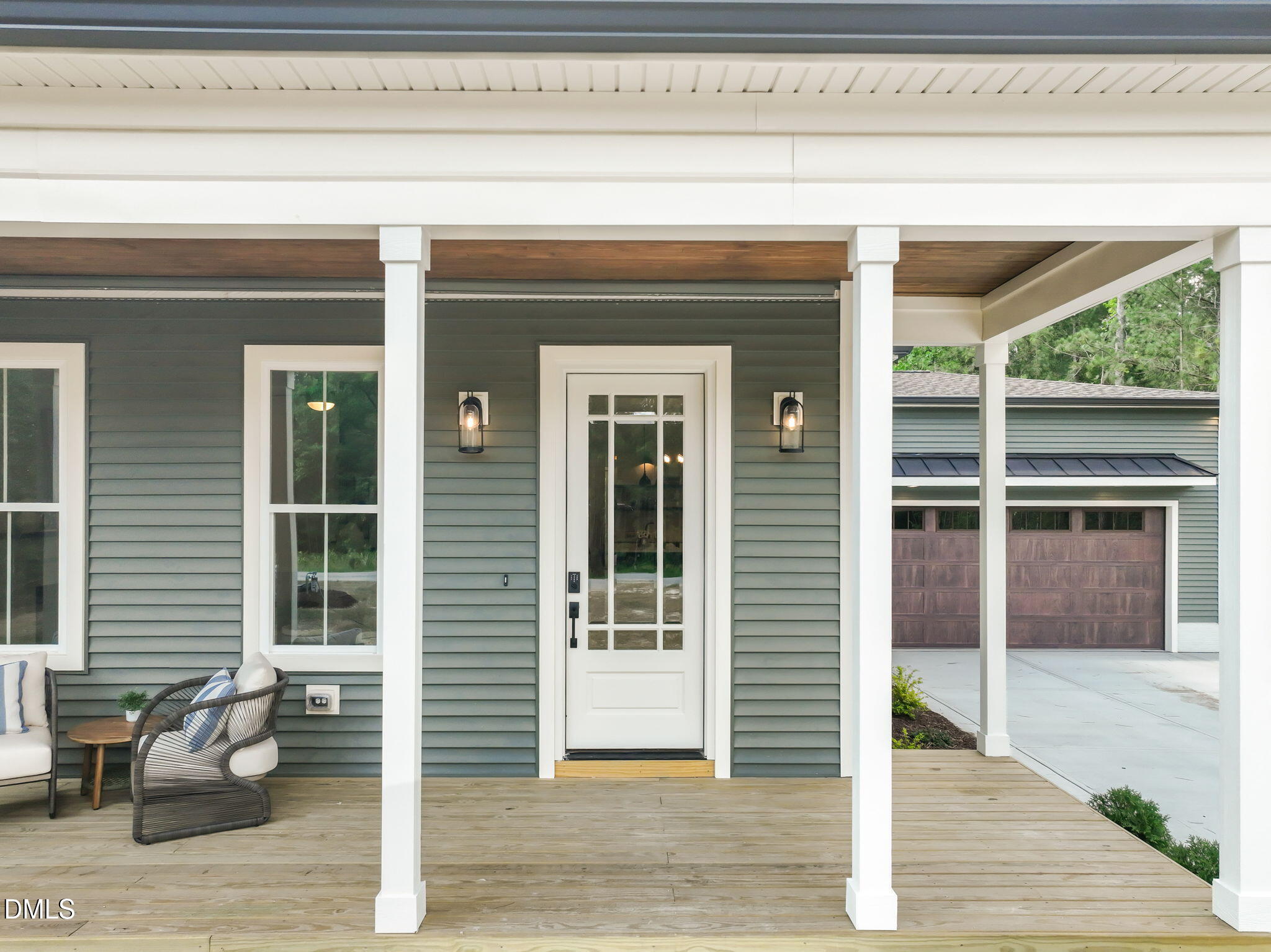 400 Pilot Ridge Road Zebulon, NC 27597 - Photo 4 of 51 a front view of a house with a outdoor space and glass windows
