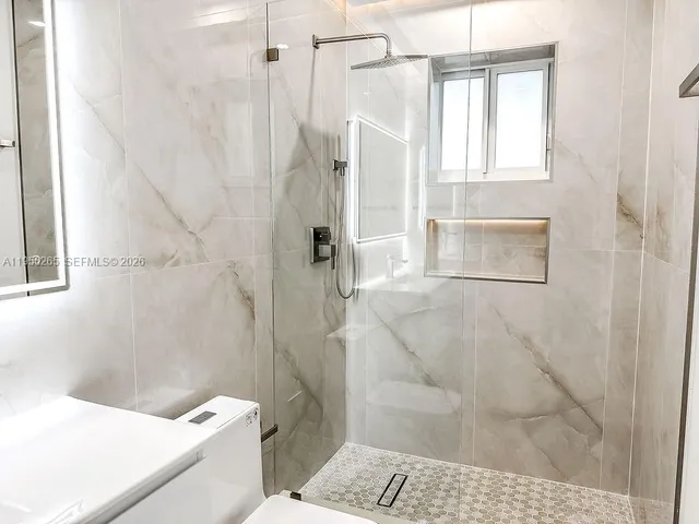 a view of staircase with white walls