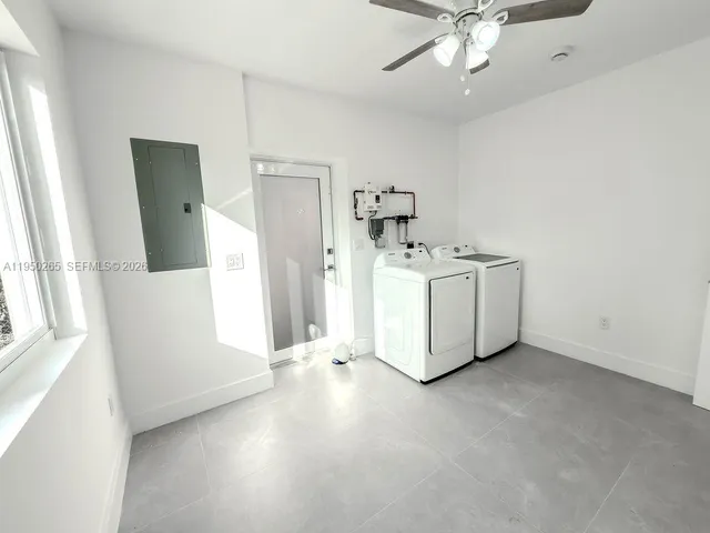 a bathroom with a shower and toilet