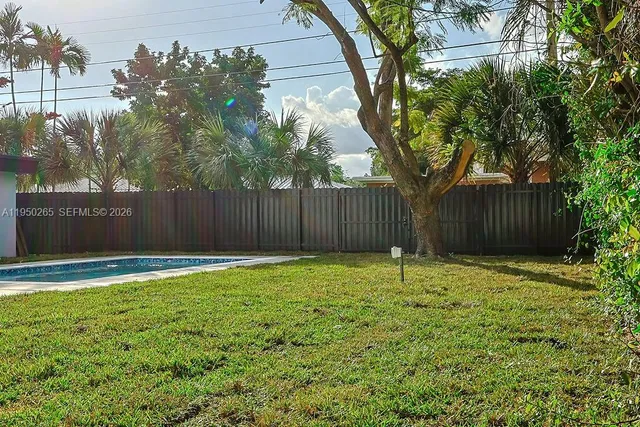 a backyard of a house with lots of green space