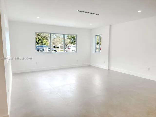 an empty room with windows