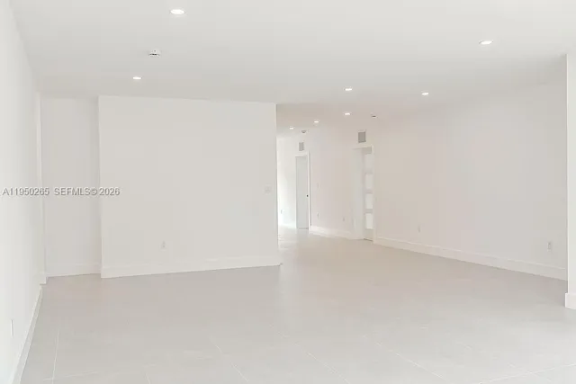 an empty room with wooden floor