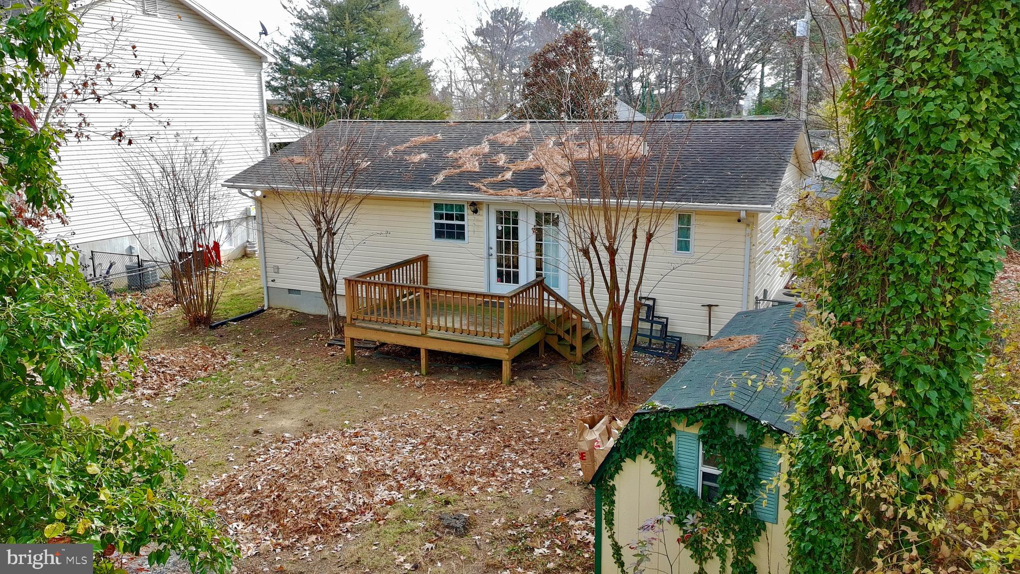 45394 Walnut Street Piney Point, MD 20674 - Photo 18 of 23 aerial view of a house with a yard and sitting area