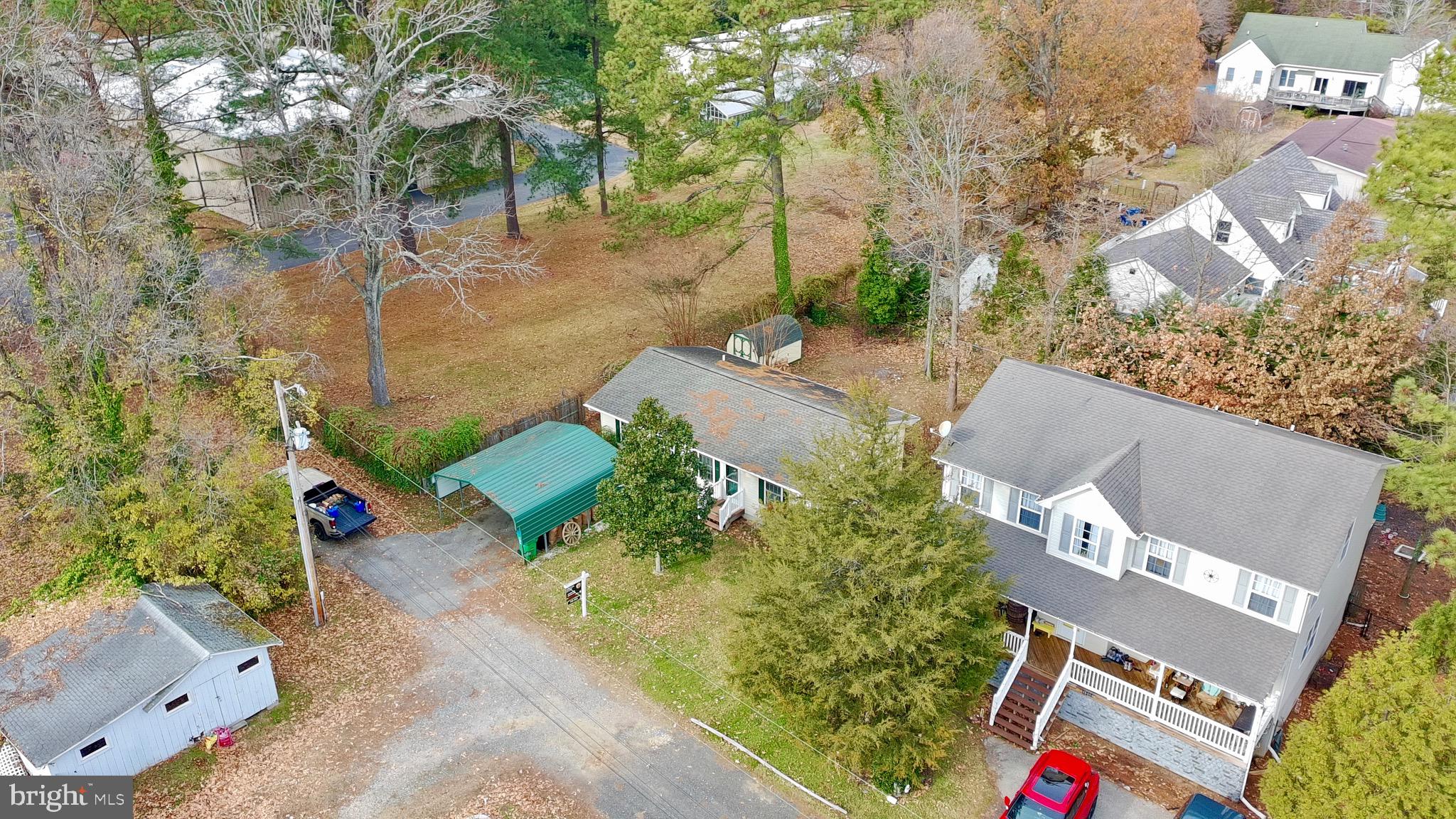45394 Walnut Street Piney Point, MD 20674 - Photo 8 of 23 an aerial view of residential house with outdoor space and trees