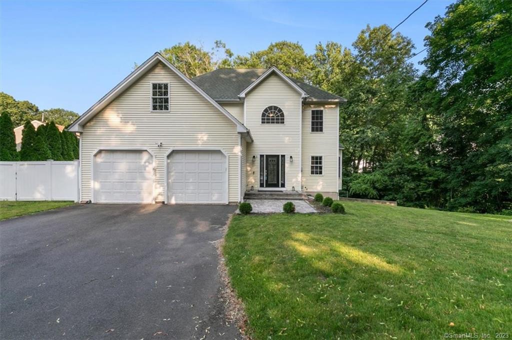 12 Mansion Road Wallingford, CT 06492 - Photo 1 of 1 a view of a yard in front of a house with plants
