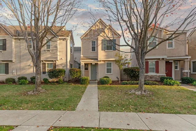 front view of a building with a yard