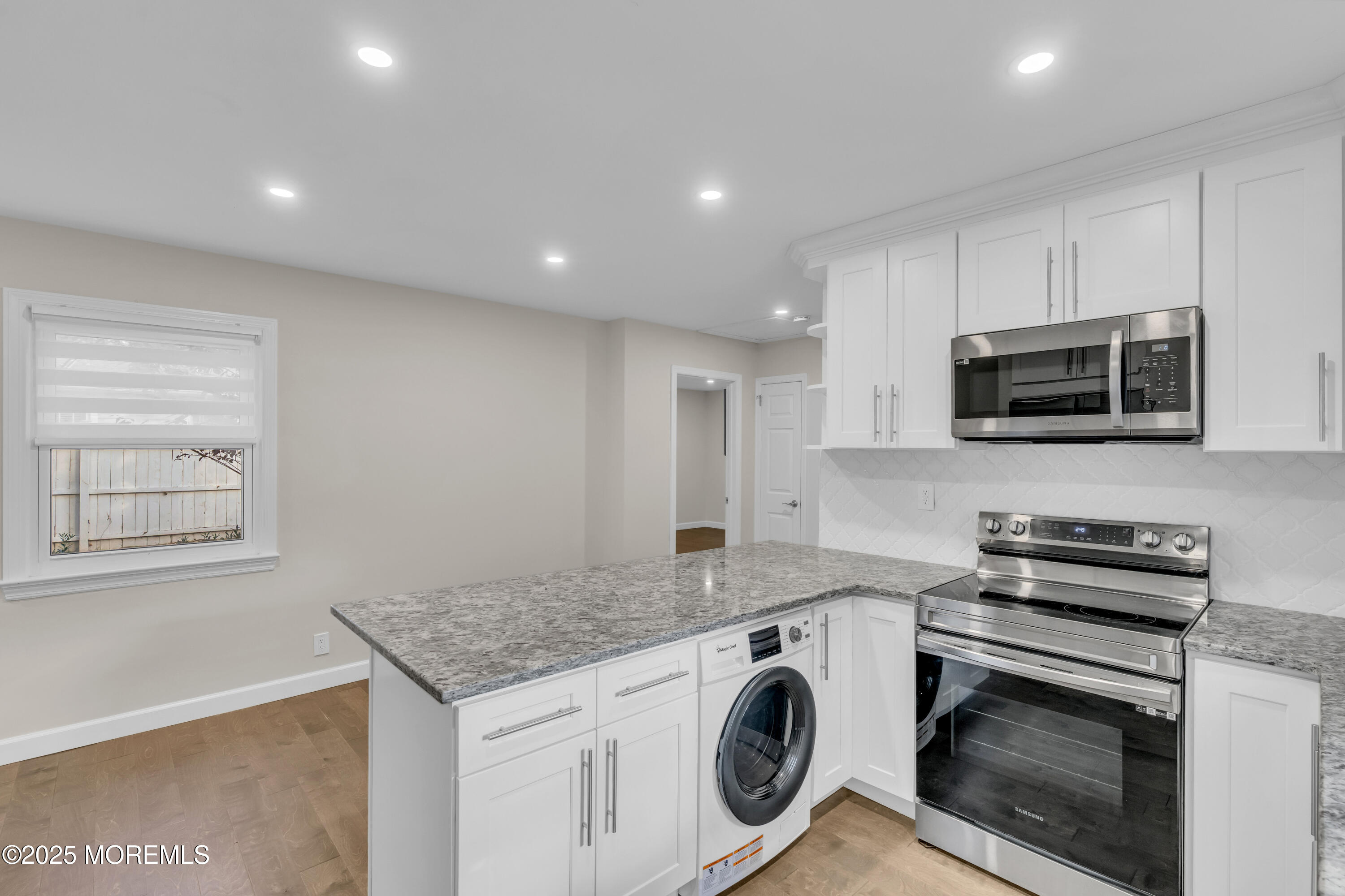 185 Elmwood Road Oakhurst, NJ 07755 - Photo 13 of 19 a kitchen with appliances a sink and cabinets