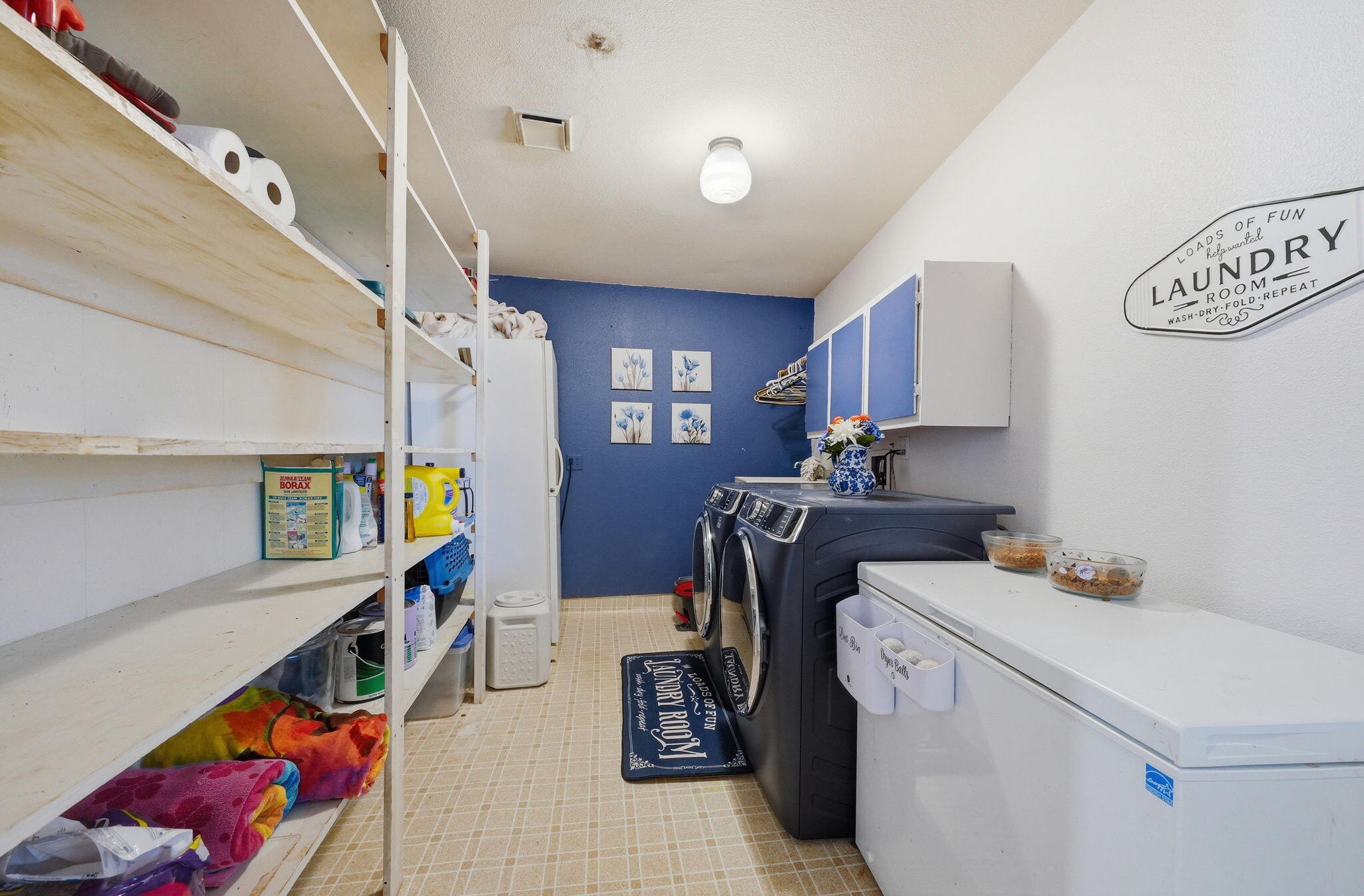 22189 Old Alturas Road Redding, CA 96003 - Photo 31 of 70 a storage room with washer and dryer