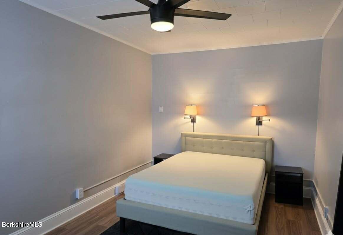 98 L Summer Street Adams, MA 01220 - Photo 7 of 17 a bedroom with a bed and a ceiling fan