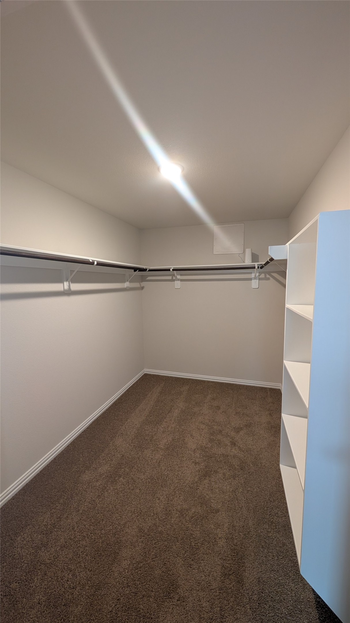 32314 Mimosa Ridge Lane Waller, TX 77484 - Photo 12 of 16 a view of a room with racks on the wall