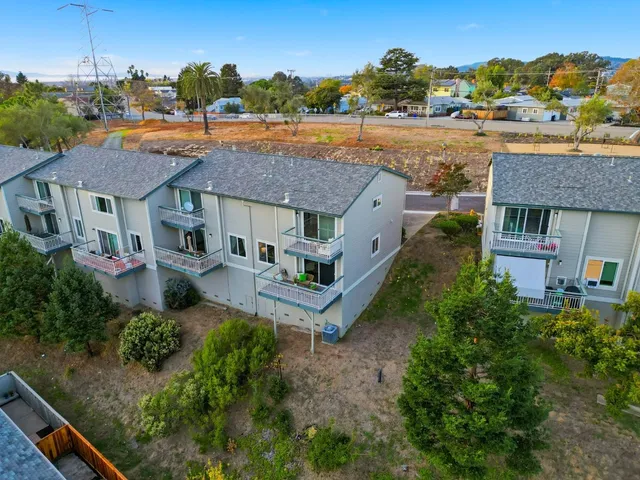 a balcony with table and chairs