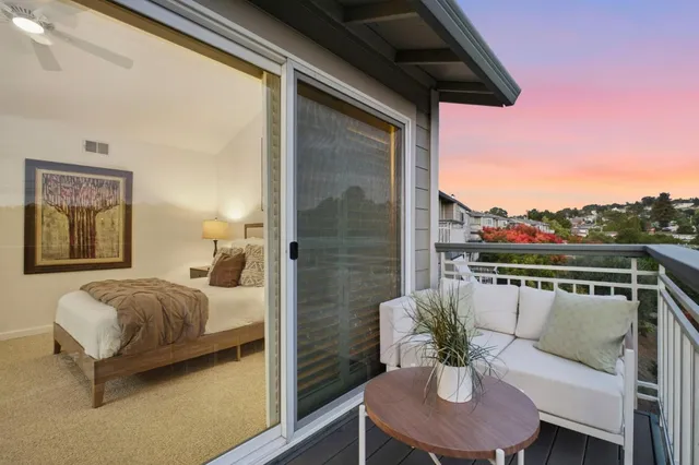 a view of a swimming pool with lounge chairs