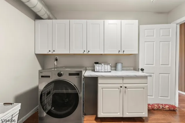 a view of cabinets and washer dryer