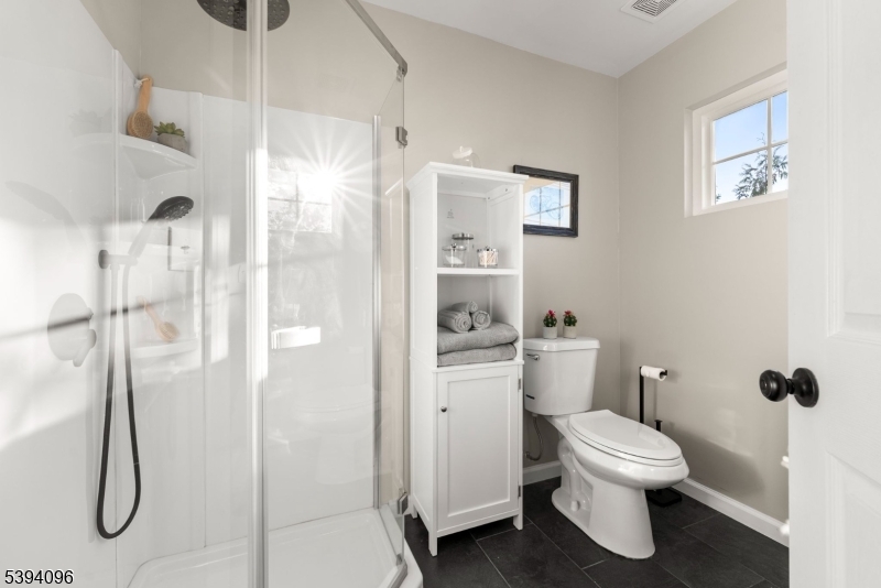 482 Springfield Avenue, Unit 2 Berkeley Heights, NJ 07922 - Photo 13 of 20 a bathroom with a toilet and a shower