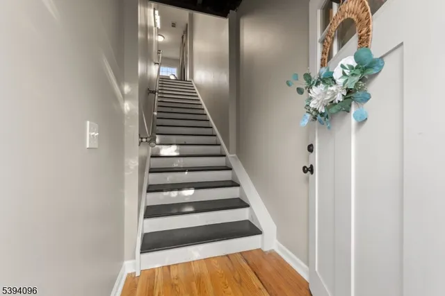 a view of entryway with wooden floor