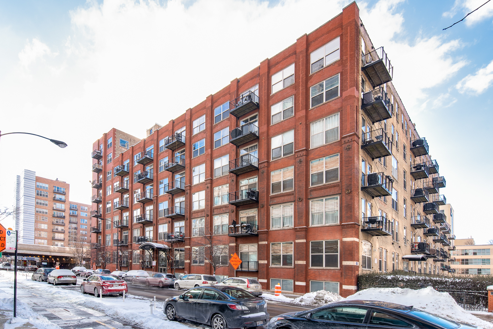 420 South Clinton Street, Unit 306A Chicago, IL 60607 - Photo 2 of 18 a city street lined with buildings and cars