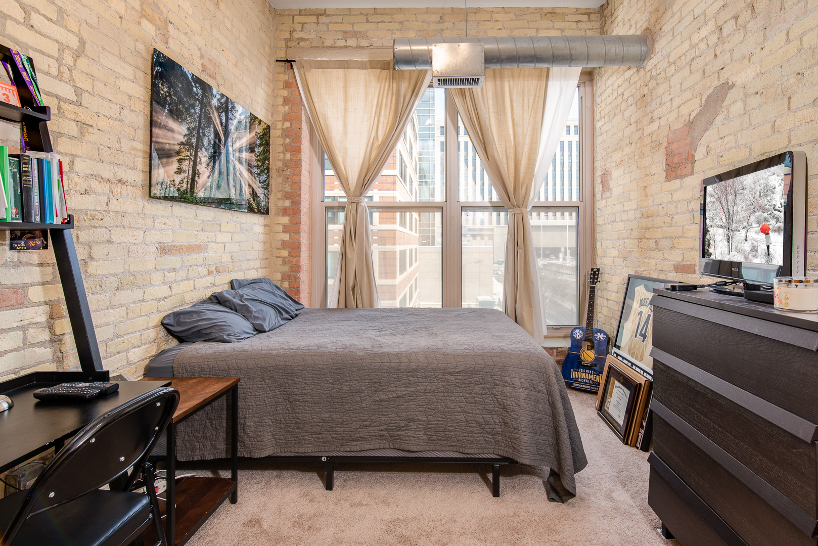 420 South Clinton Street, Unit 306A Chicago, IL 60607 - Photo 11 of 18 a bedroom with a bed and a window