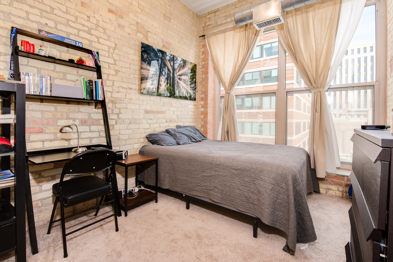 420 South Clinton Street, Unit 306A Chicago, IL 60607 - Photo 12 of 18 a bedroom with a bed chair and a window