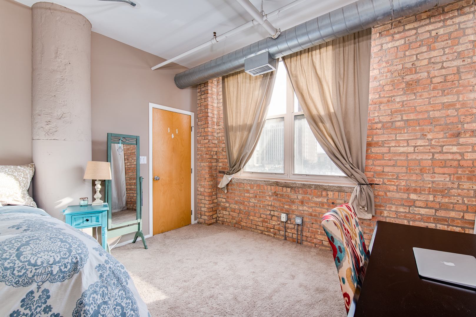 420 South Clinton Street, Unit 306A Chicago, IL 60607 - Photo 15 of 18 a bedroom with a bed and a window