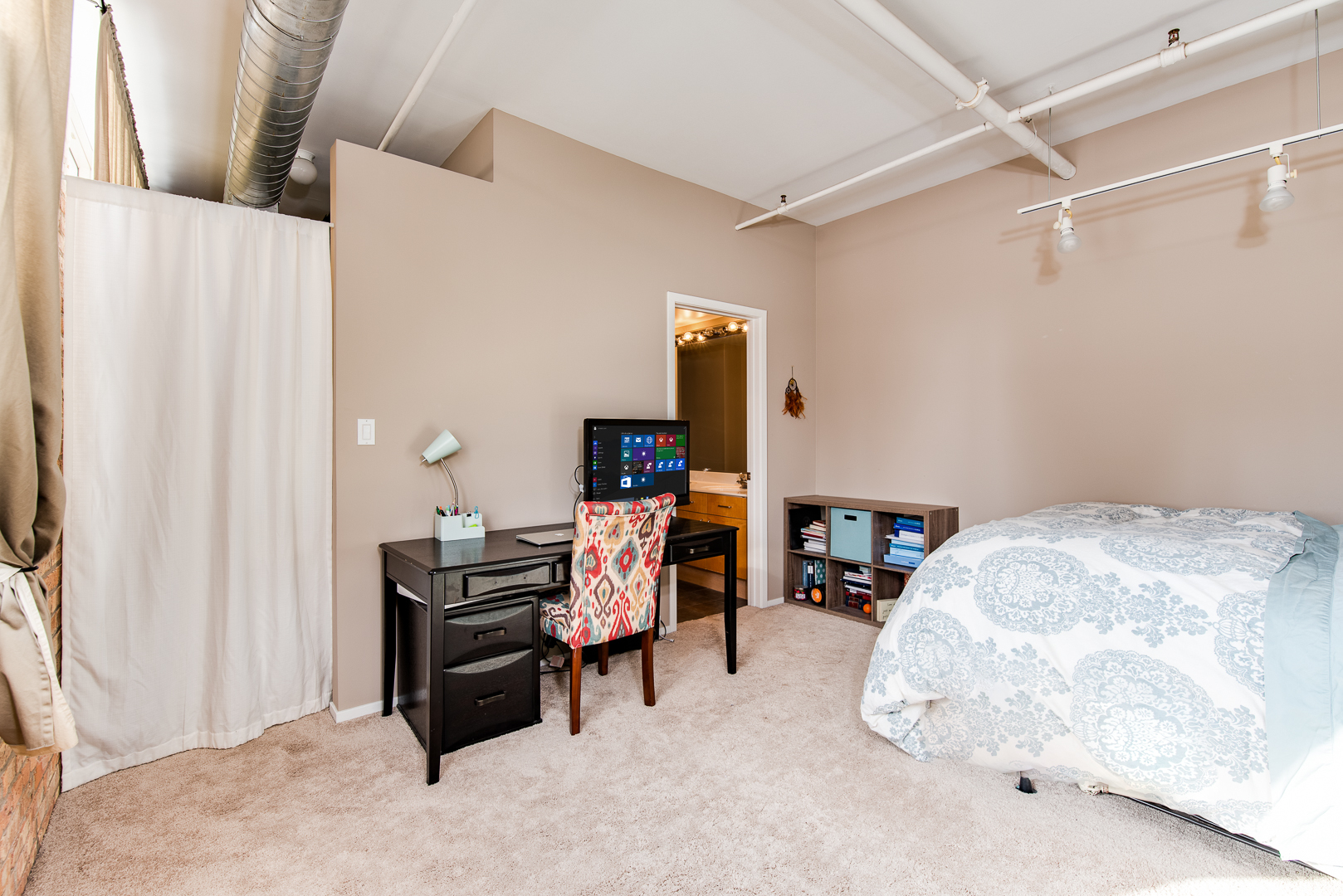 420 South Clinton Street, Unit 306A Chicago, IL 60607 - Photo 16 of 18 a bedroom with a bed and a window