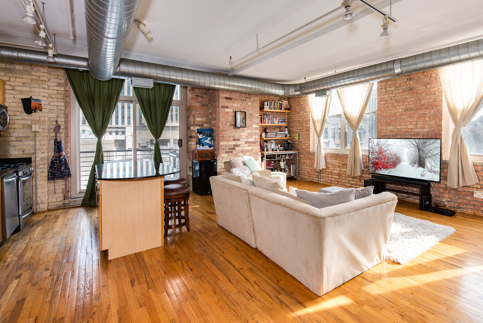 420 South Clinton Street, Unit 306A Chicago, IL 60607 - Photo 4 of 18 a living room with furniture and a large window