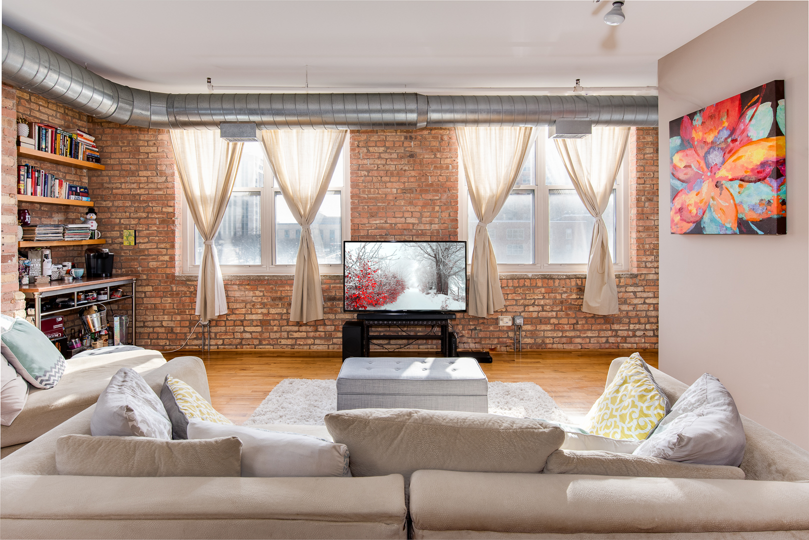 420 South Clinton Street, Unit 306A Chicago, IL 60607 - Photo 5 of 18 a living room with furniture and a large window