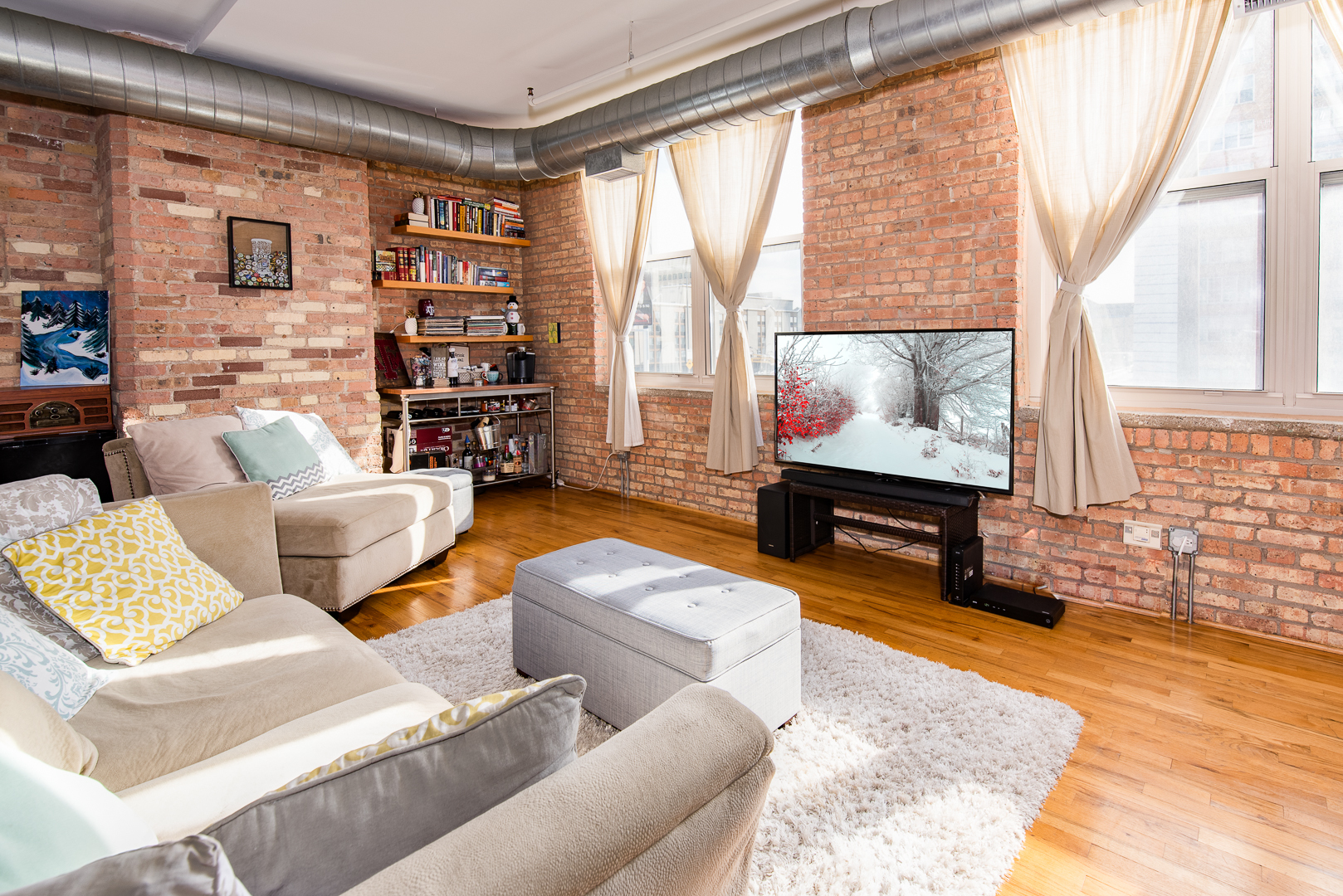 420 South Clinton Street, Unit 306A Chicago, IL 60607 - Photo 6 of 18 a living room with fireplace furniture and a flat screen tv