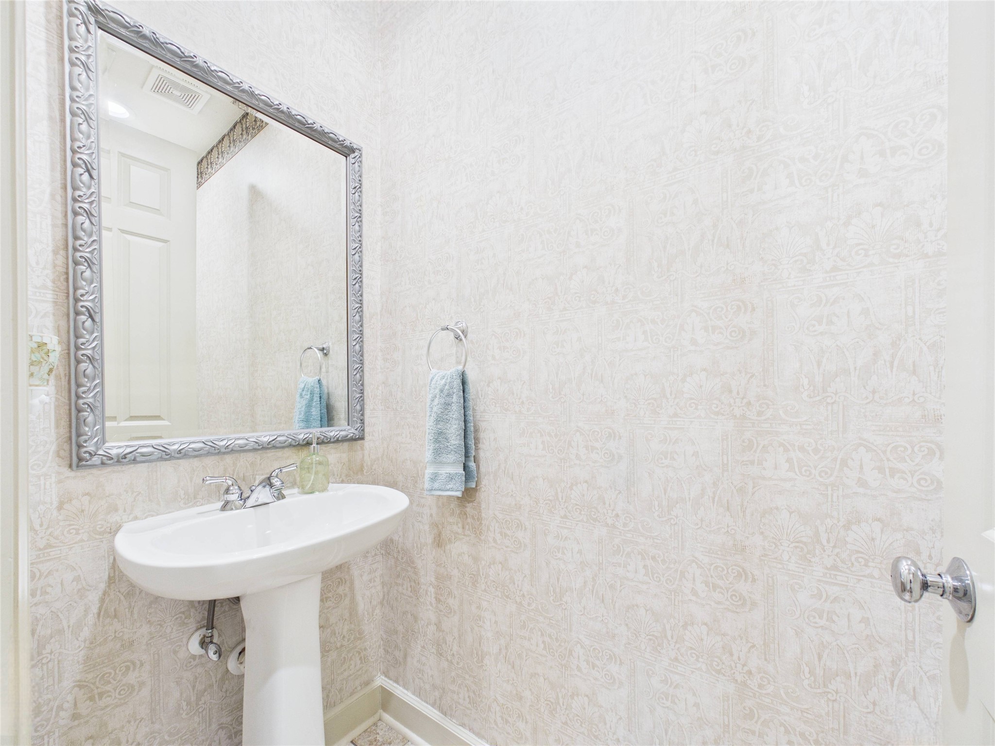 403 Harborside Way Kemah, TX 77565 - Photo 8 of 39 Convenient powder room tucked between garage and kitchen