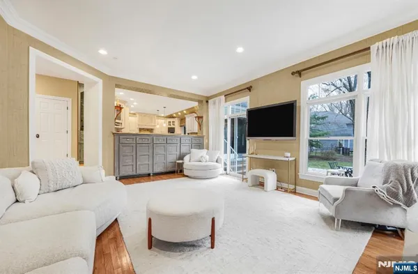 a living room with furniture a window and a fireplace