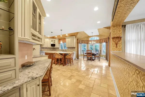 a view of a living room and kitchen