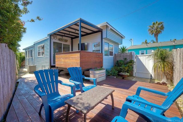 a view of a chair and table in the patio