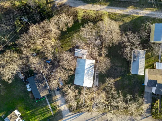 a aerial view of a house with a yard