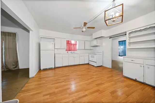 a view of a kitchen with a sink cabinets and a window
