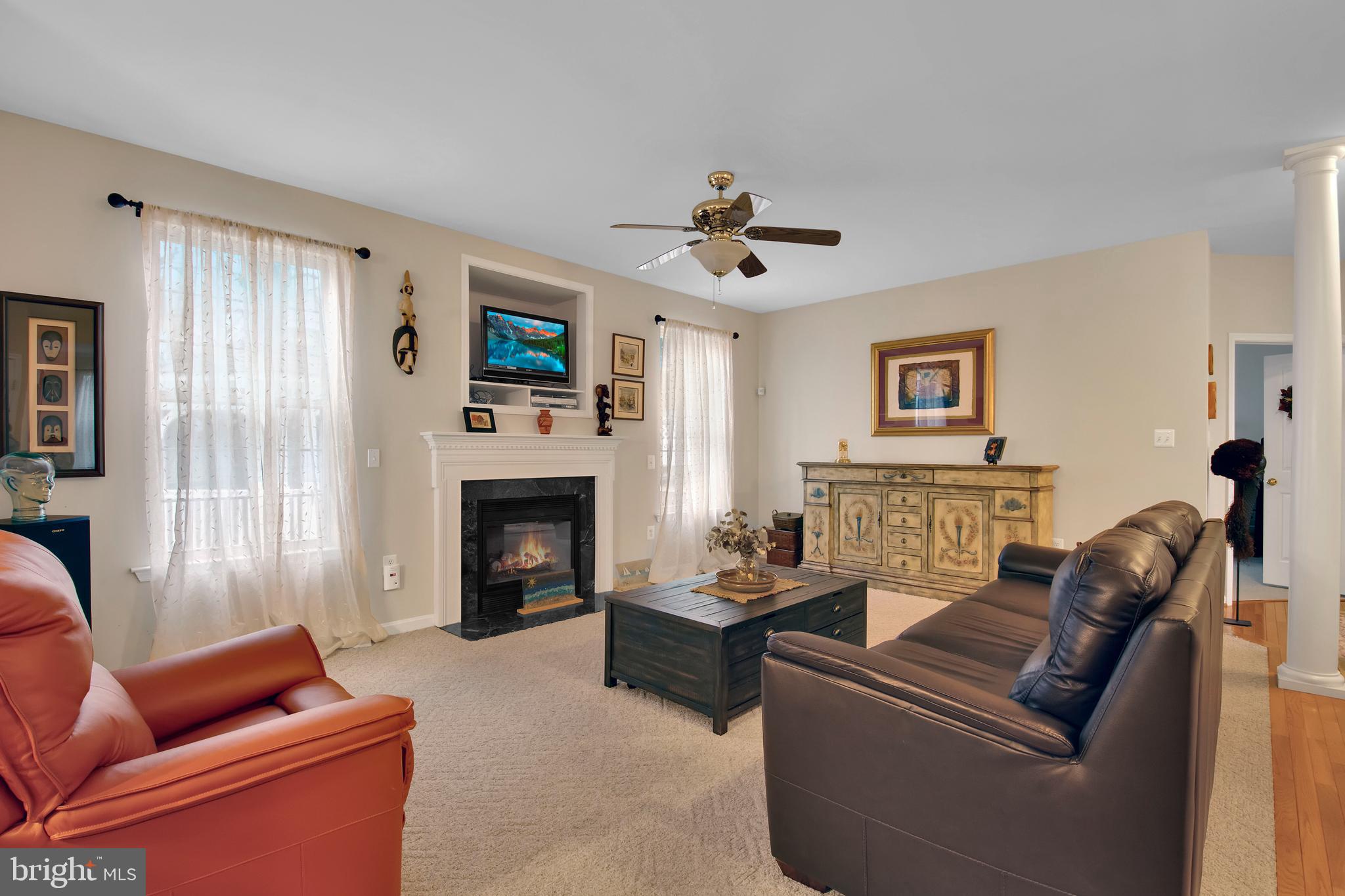 5534 Nutwell Sudley Road Deale, MD 20751 - Photo 13 of 51 a living room with furniture a fireplace and a flat screen tv